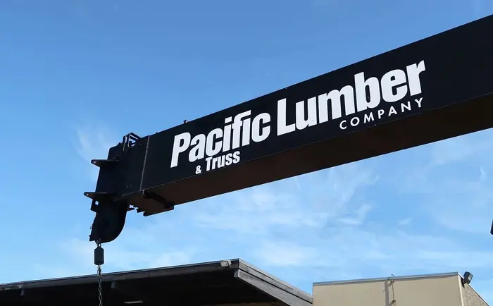 Truss crane with Pacific Lumber logo